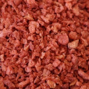 A close up of a pile of red meat.