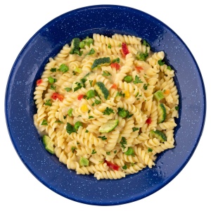 A plate of Mountain House Pasta Primavera with vegetables and peppers on a white background.