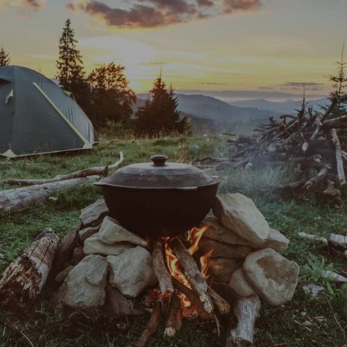 A first extreme outdoor activity guide featuring a campfire and mountains.