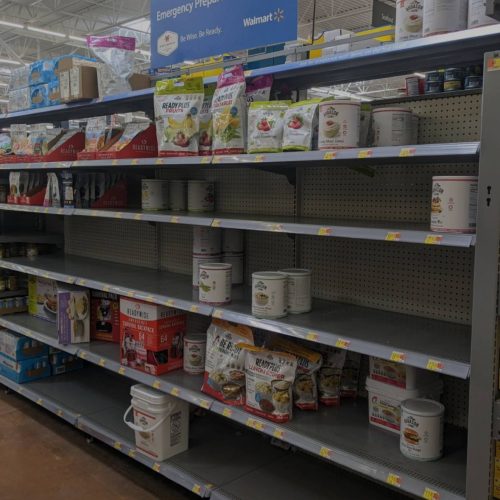 An empty shelf in a grocery store during food shortages.