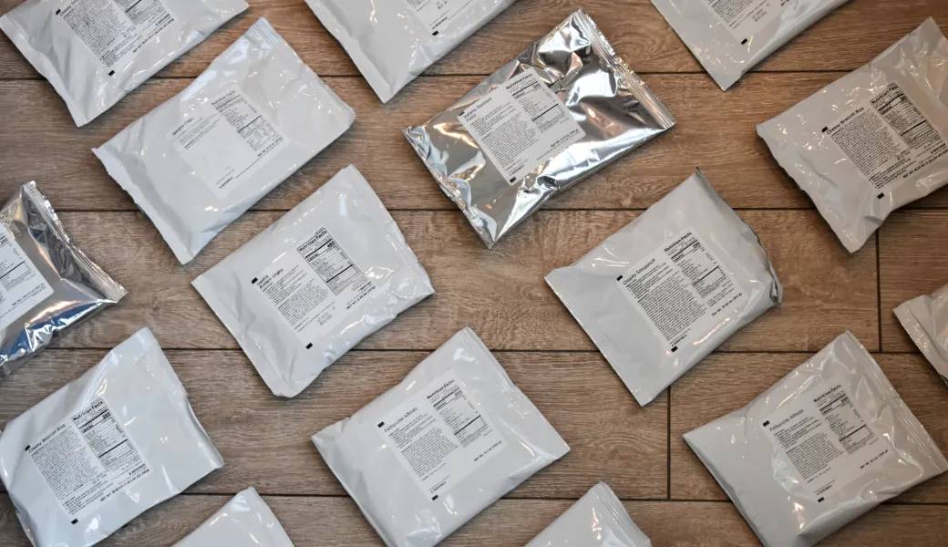 A group of plastic bags on a wooden floor shipped within 1-2 weeks.