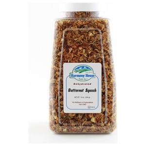 A jar of dried apricots on a white background.
