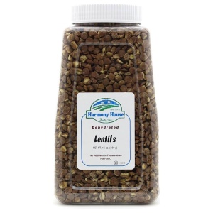 A jar of linseeds on a white background.