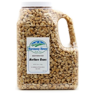 A jug of roasted pistachios on a white background.