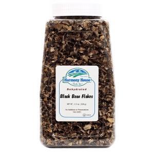 A jar of black truffles on a white background.