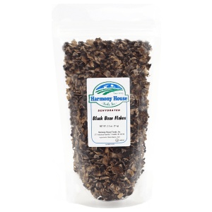 A bag of black walnuts on a white background.