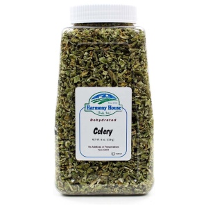 A jar of dried celery on a white background.