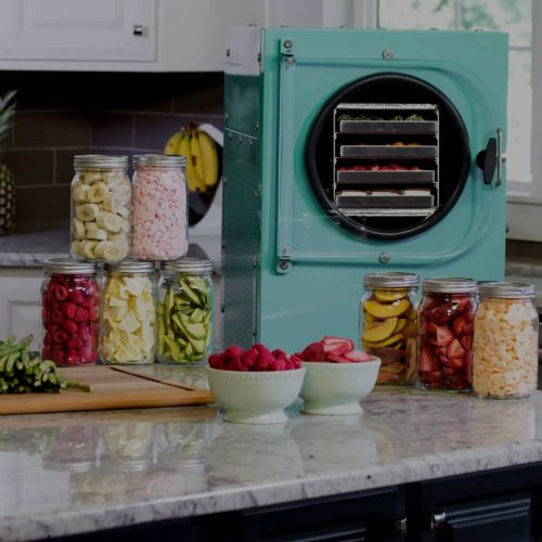 A kitchen with a refrigerator and jars on the counter showcases the advancements in freezing technology.