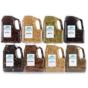 A group of jars with different kinds of bean and legume seeds in them.