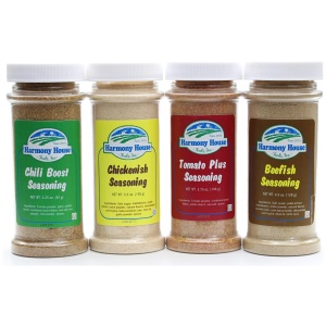 Four jars of emergency food storage seasonings on a white background.