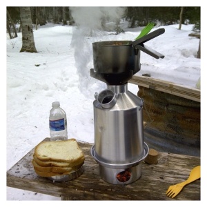 A pot of soup and bread on a table for emergency food storage.